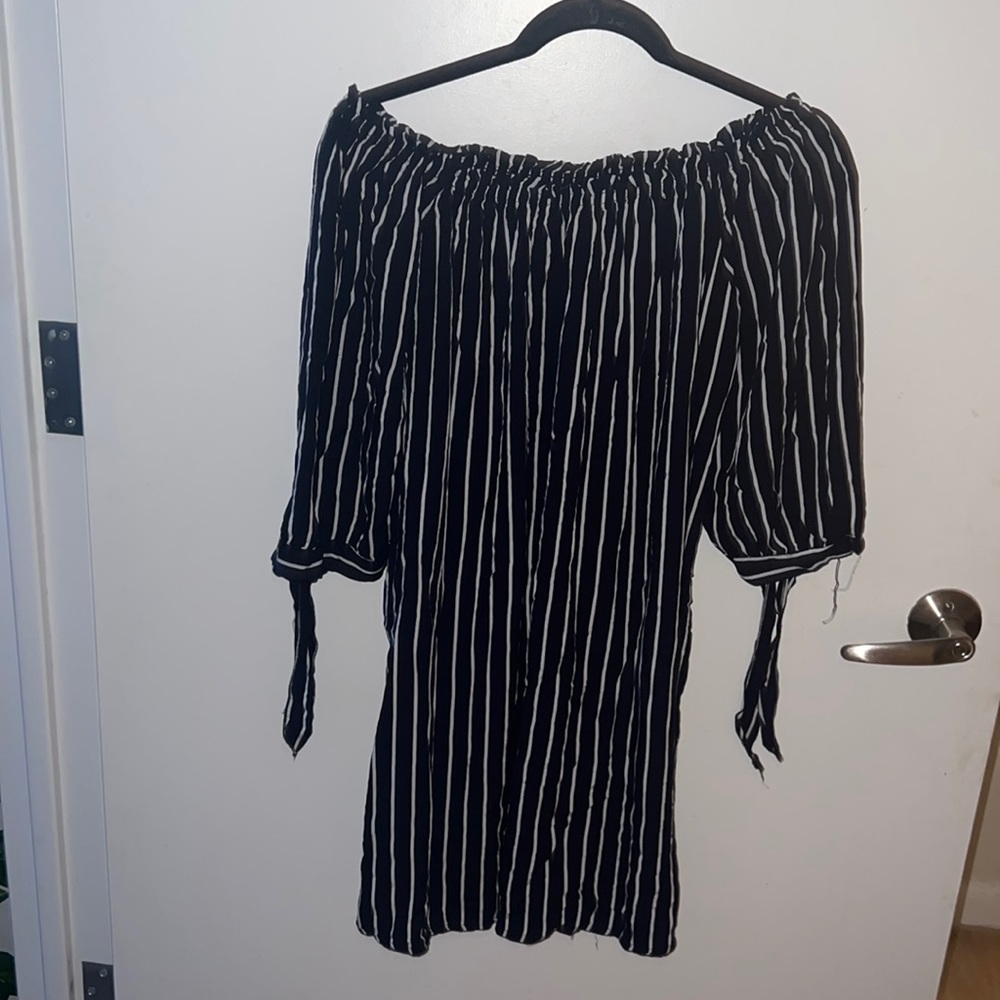 Woman’s off the shoulder striped dress